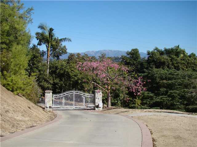 3083 Dos Lomas Fallbrook, CA 92028 - Photo 1 of 16 Attractive gate with a concrete drive leading up to the home.