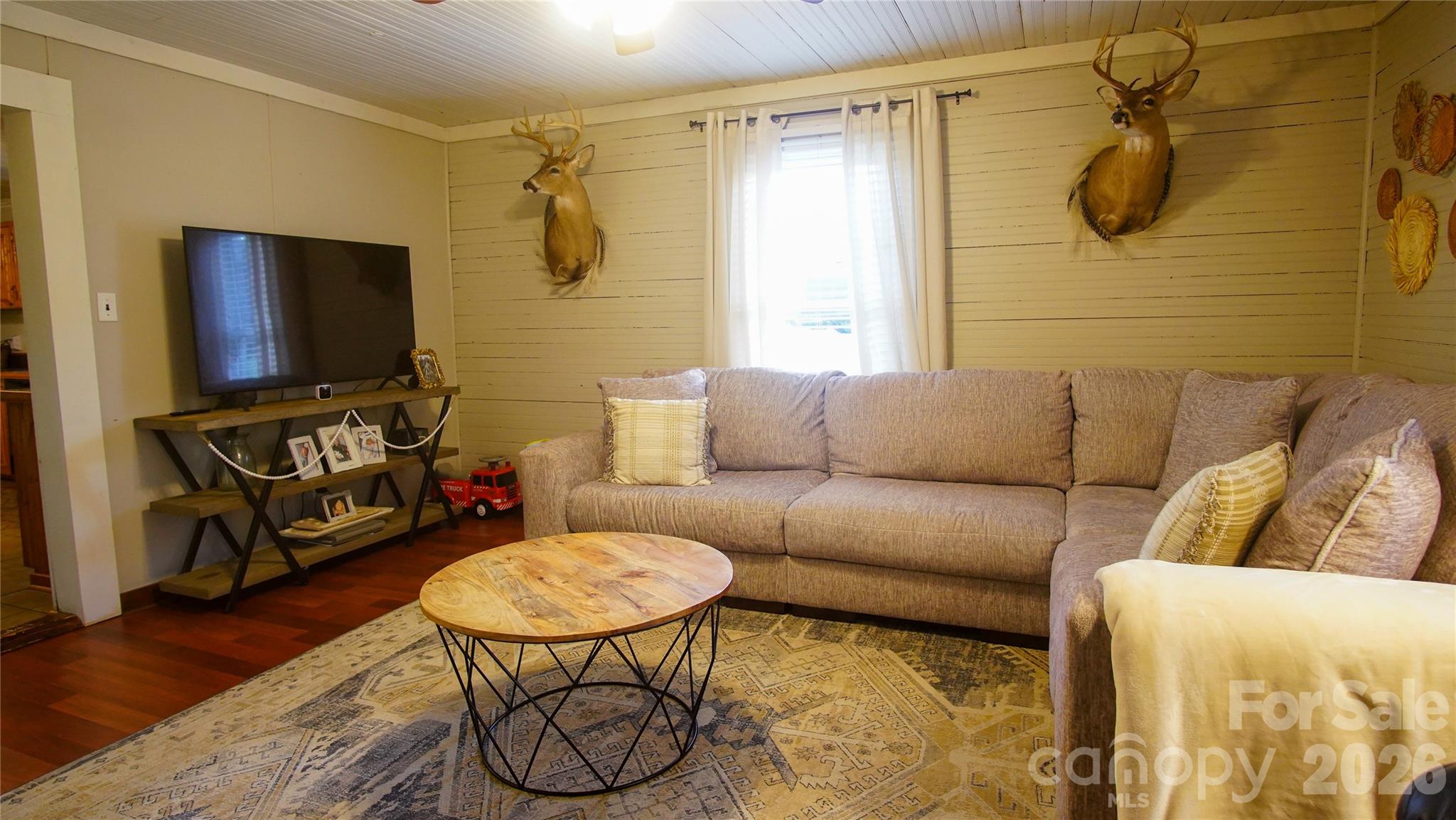 740 Moriah Church Road Casar, NC 28020 - Photo 16 of 31 a living room with furniture and a flat screen tv