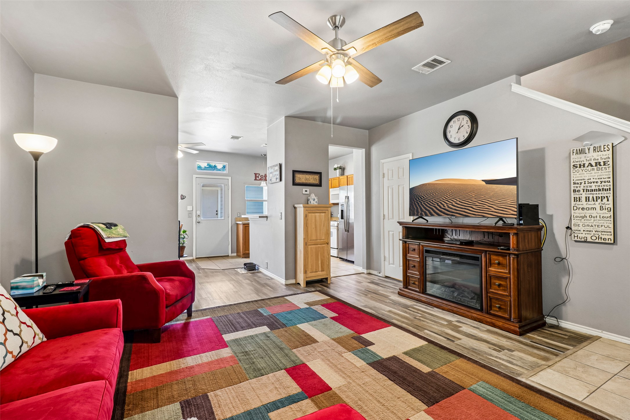 311 A Utterback Kyle, TX 78640 - Photo 9 of 40 a living room with furniture and a flat screen tv