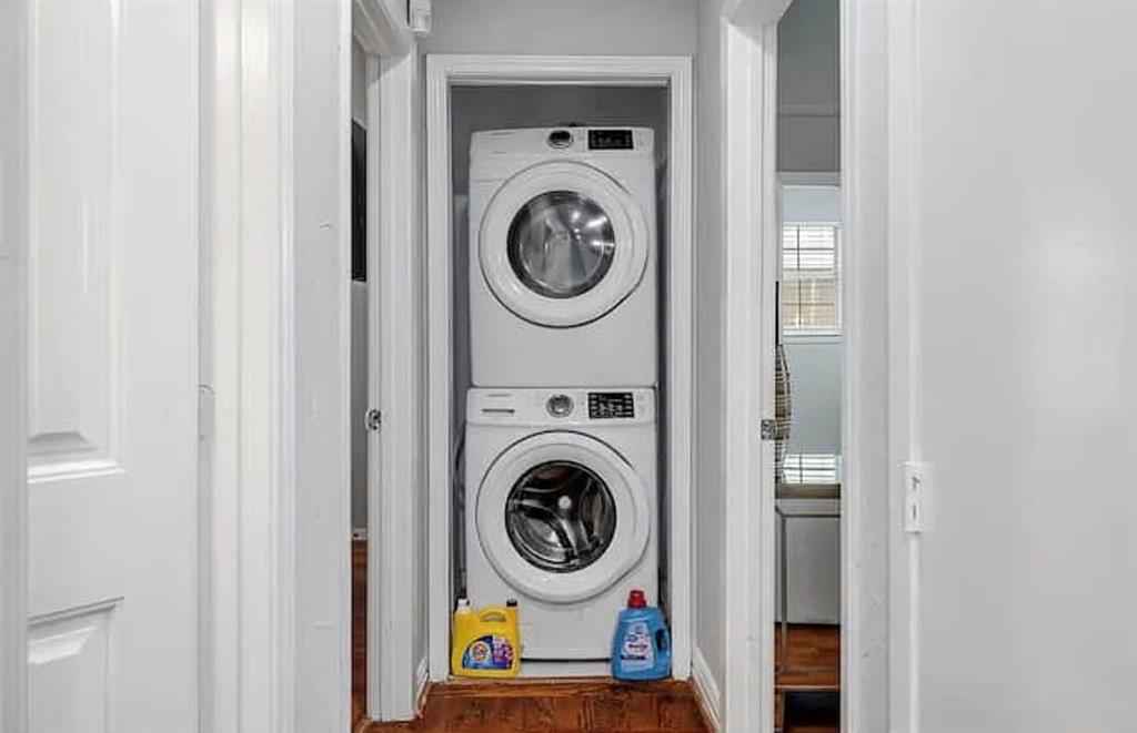 1718 Ripley Street Dallas, TX 75204 - Photo 13 of 33 Stacked washer and dryer unit, wood-finish flooring