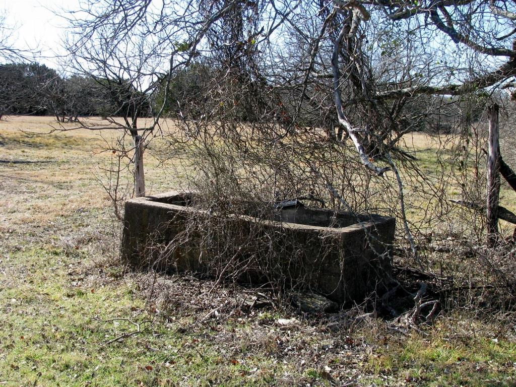 Tbd Lot 4 Tbd Road Gatesville, TX 76528 - Photo 4 of 16 a view of a yard with wooden fence and plants