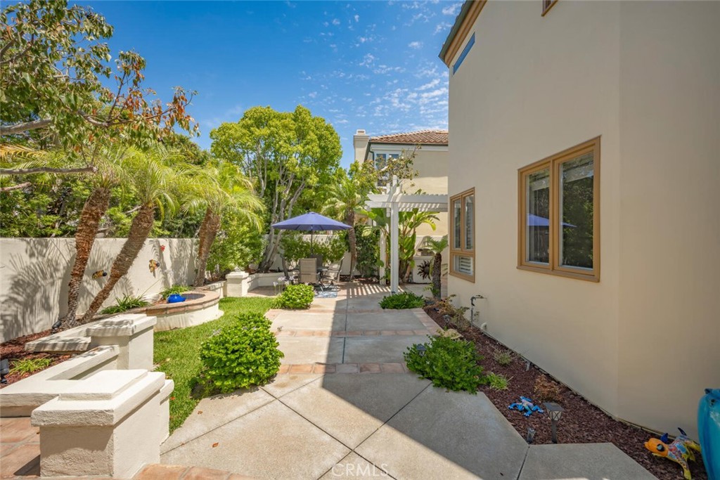 6546 Morningside Drive Huntington Beach, CA 92648 - Photo 17 of 74 a view of a porch with chairs and potted plants