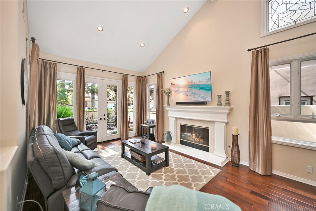 6546 Morningside Drive Huntington Beach, CA 92648 - Photo 22 of 74 a living room with furniture large window and a fireplace