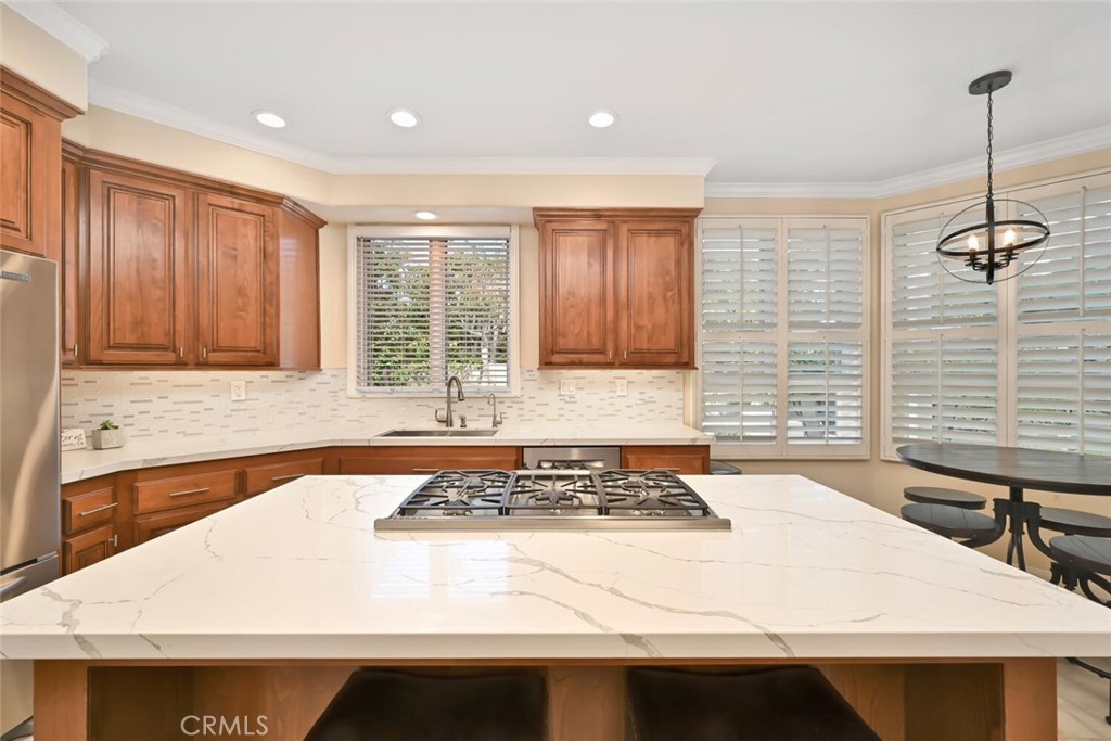 6546 Morningside Drive Huntington Beach, CA 92648 - Photo 30 of 74 a kitchen with a sink a stove and a window