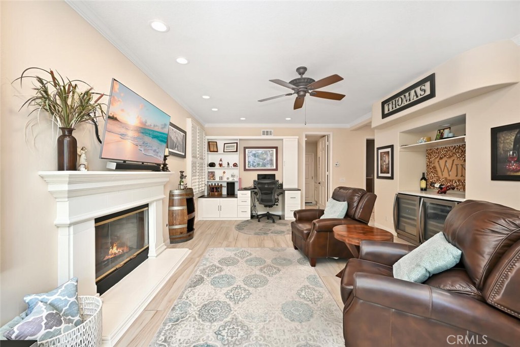 6546 Morningside Drive Huntington Beach, CA 92648 - Photo 38 of 74 a living room with furniture fireplace and window