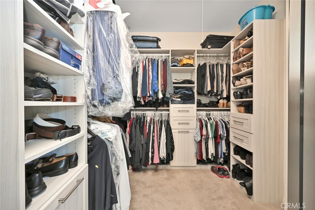 6546 Morningside Drive Huntington Beach, CA 92648 - Photo 53 of 74 a view of walk in closet with clothes and shoes