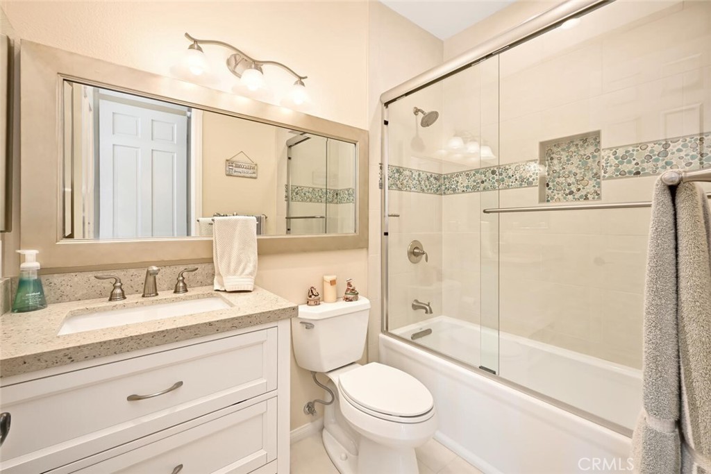 6546 Morningside Drive Huntington Beach, CA 92648 - Photo 61 of 74 a bathroom with a granite countertop sink toilet and shower