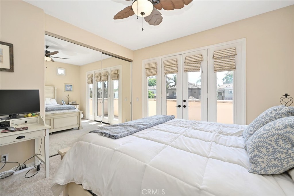 6546 Morningside Drive Huntington Beach, CA 92648 - Photo 65 of 74 a bedroom with a bed window and a flat screen tv