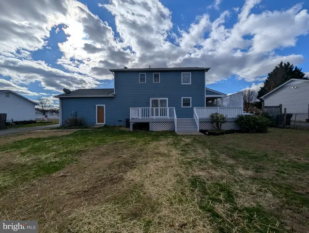 a view of a house with a back yard