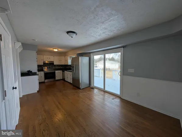a view of a electric appliances in kitchen and empty room