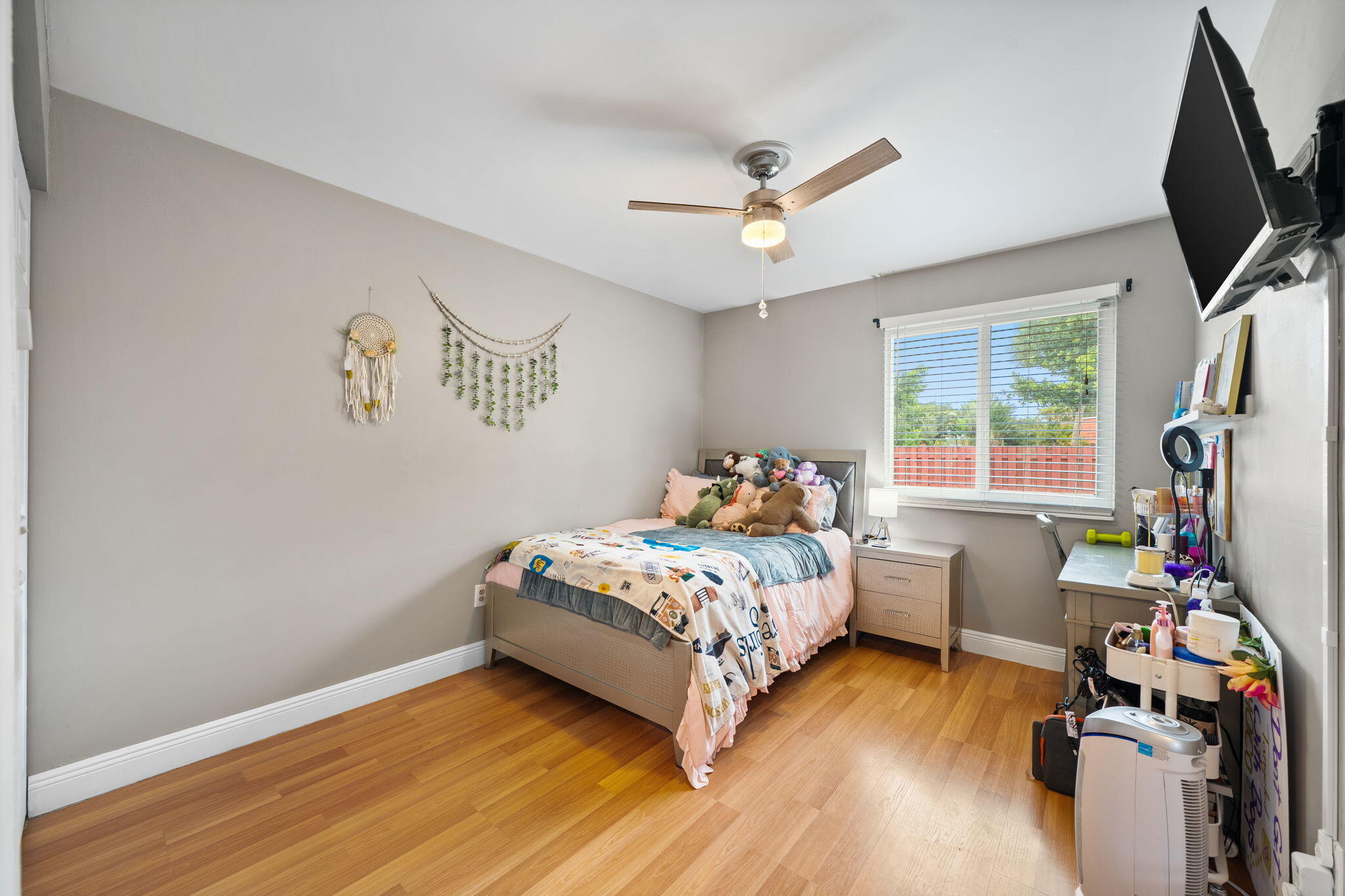 8374 Dynasty Drive Boca Raton, FL 33433 - Photo 14 of 30 a bed room with a bed window and a flat tv screen