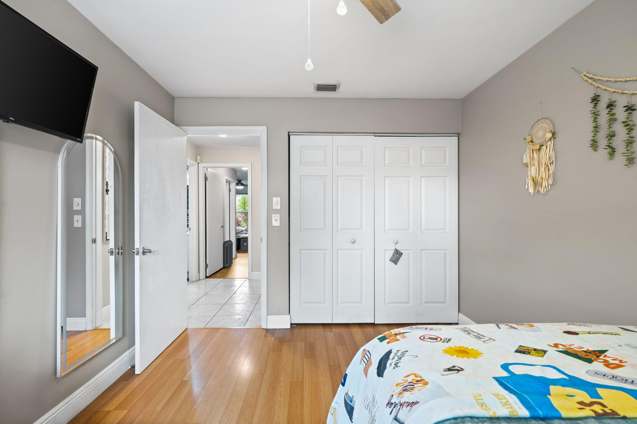 8374 Dynasty Drive Boca Raton, FL 33433 - Photo 15 of 30 a bedroom with a bed and a flat screen tv