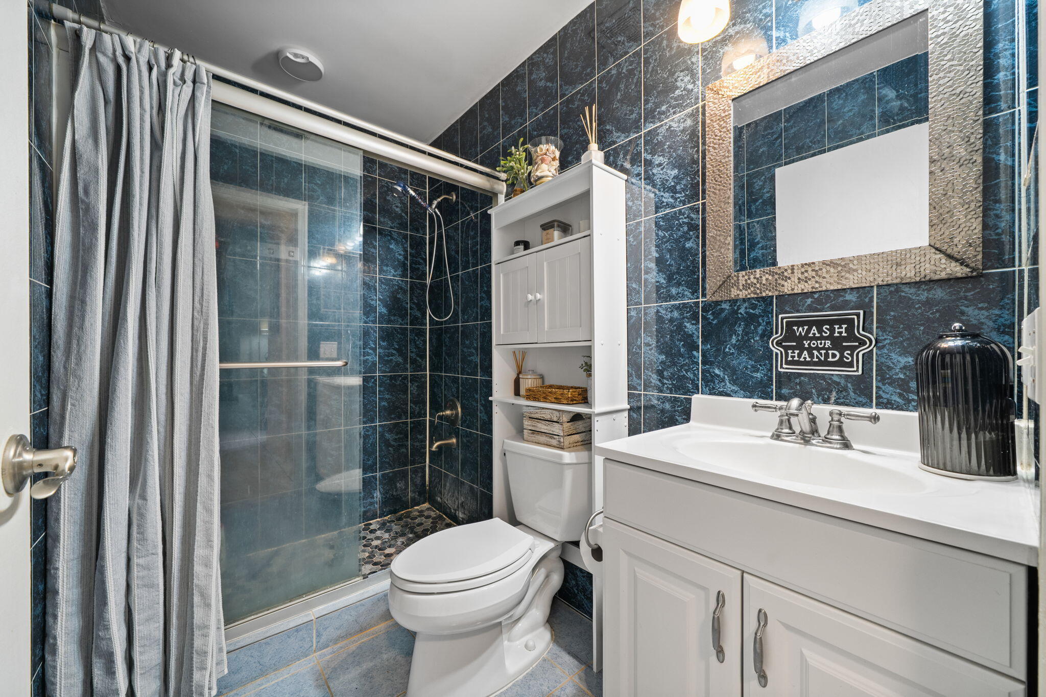 8374 Dynasty Drive Boca Raton, FL 33433 - Photo 18 of 30 a bathroom with a sink toilet and shower