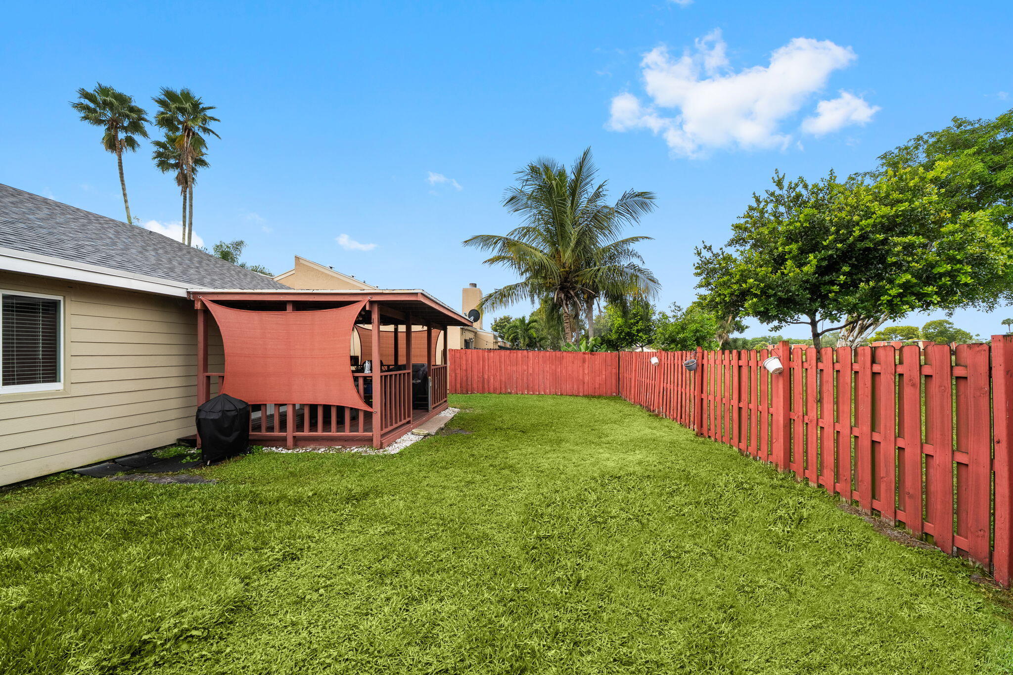 8374 Dynasty Drive Boca Raton, FL 33433 - Photo 23 of 30 a view of a backyard with a garden