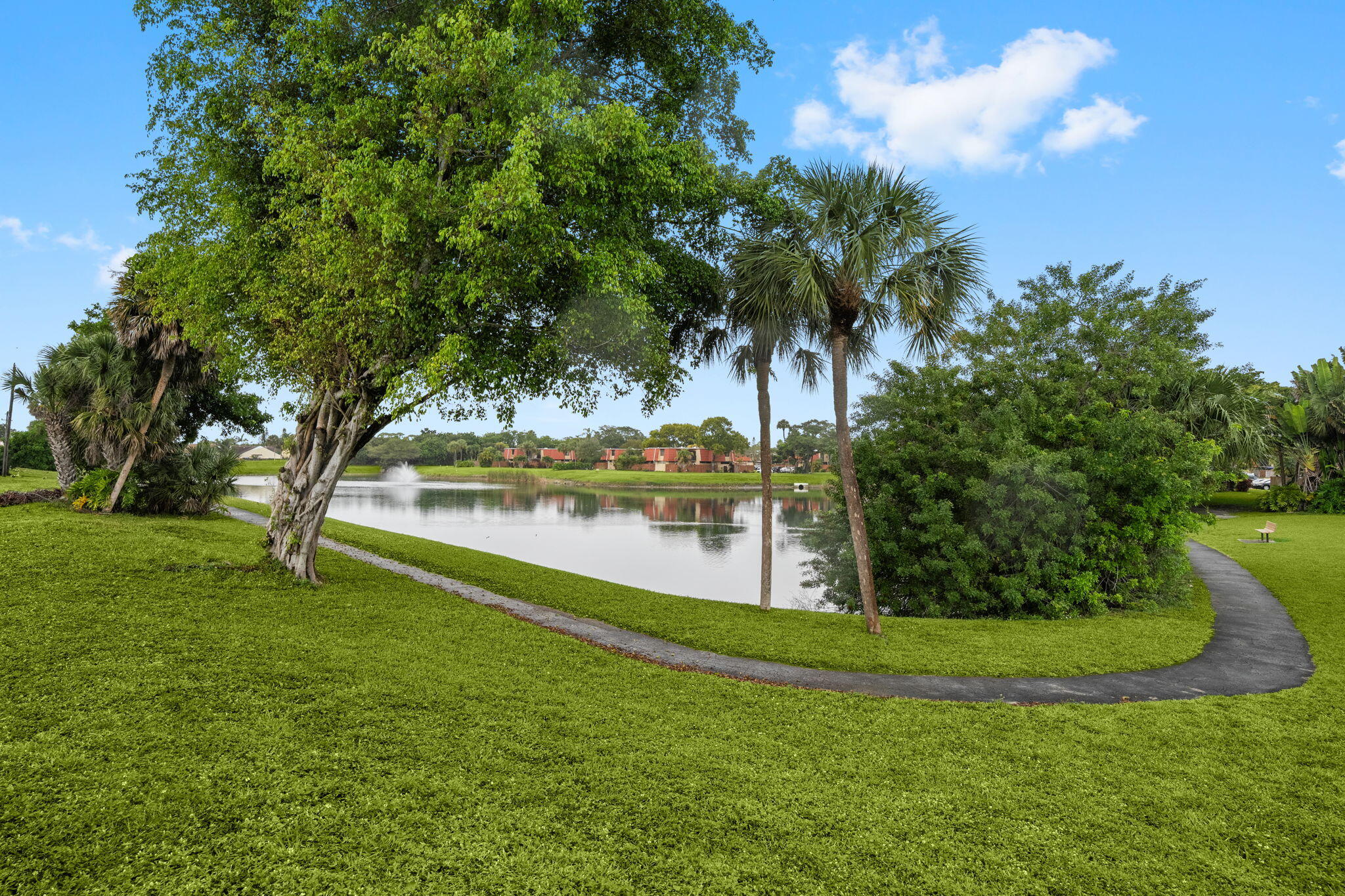 8374 Dynasty Drive Boca Raton, FL 33433 - Photo 26 of 30 a view of a lake with a yard