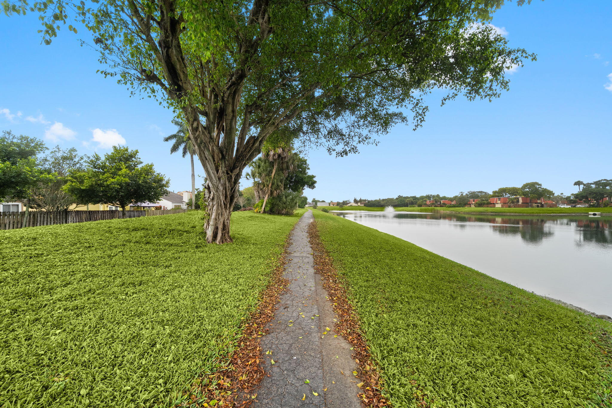 8374 Dynasty Drive Boca Raton, FL 33433 - Photo 27 of 30 a view of a lake with a big yard