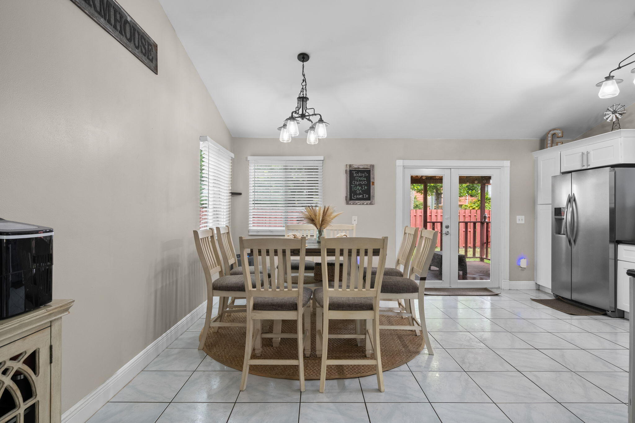 8374 Dynasty Drive Boca Raton, FL 33433 - Photo 7 of 30 a view of a dining room with furniture and chandelier