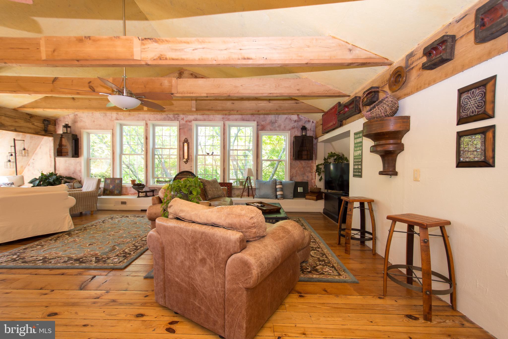 608 Charles Avenue Deale, MD 20751 - Photo 20 of 41 a living room with furniture large window and wooden floor