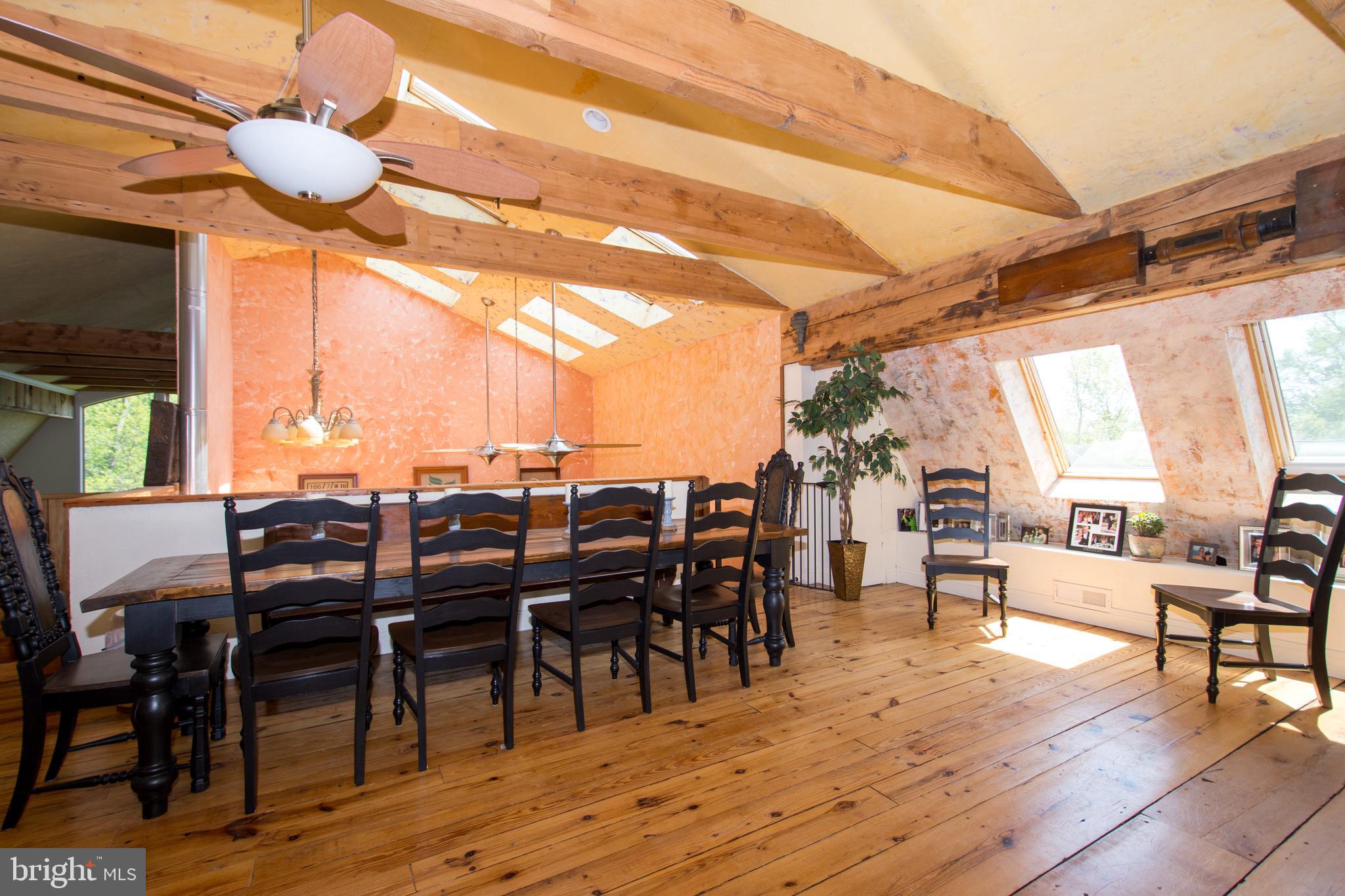 608 Charles Avenue Deale, MD 20751 - Photo 25 of 41 a view of a dining room with furniture window and wooden floor