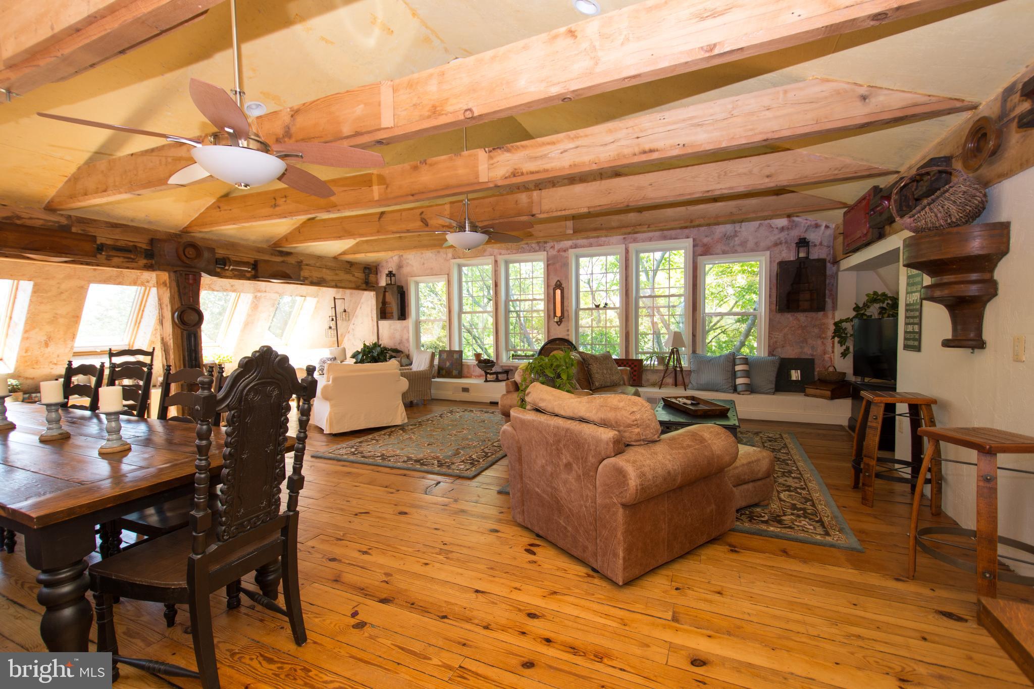 608 Charles Avenue Deale, MD 20751 - Photo 26 of 41 a living room with furniture and a chandelier