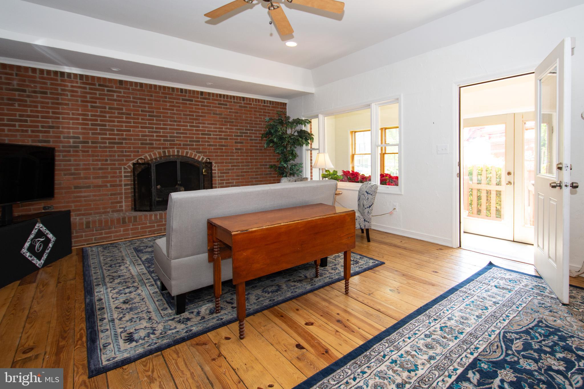 608 Charles Avenue Deale, MD 20751 - Photo 3 of 41 a living room with furniture and a fireplace