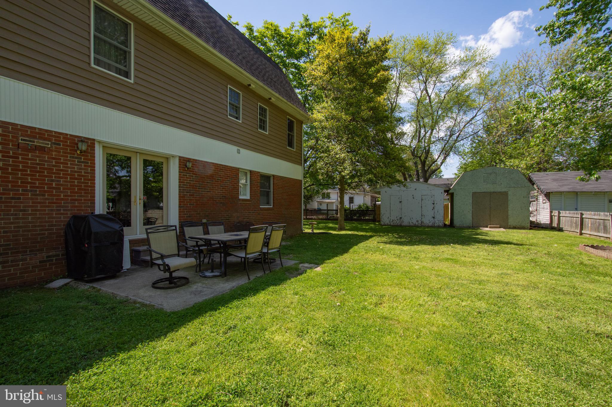608 Charles Avenue Deale, MD 20751 - Photo 38 of 41 a view of backyard of house with table and chairs