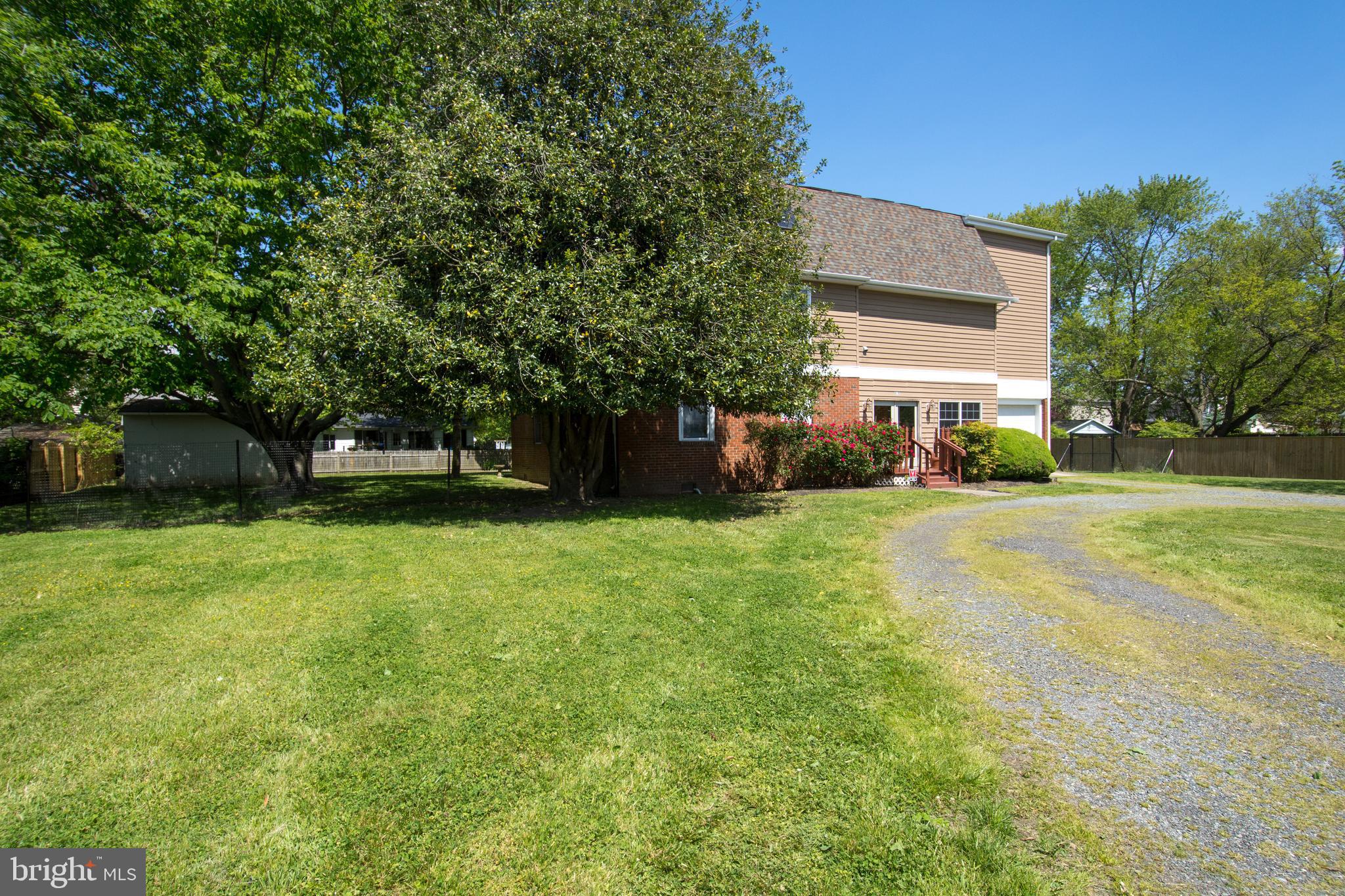 608 Charles Avenue Deale, MD 20751 - Photo 39 of 41 a front view of a house with a yard
