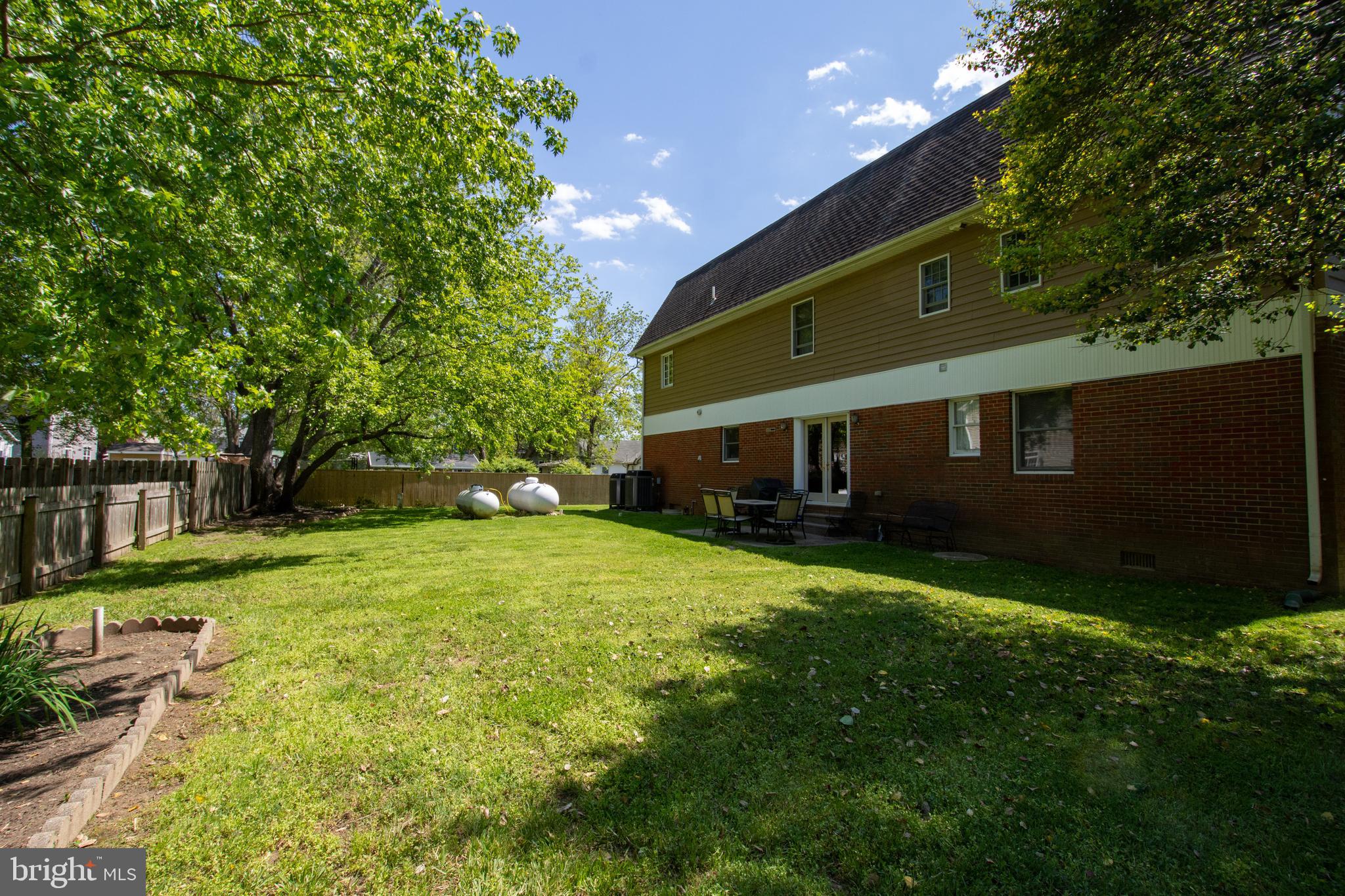 608 Charles Avenue Deale, MD 20751 - Photo 40 of 41 a front view of a house with a yard