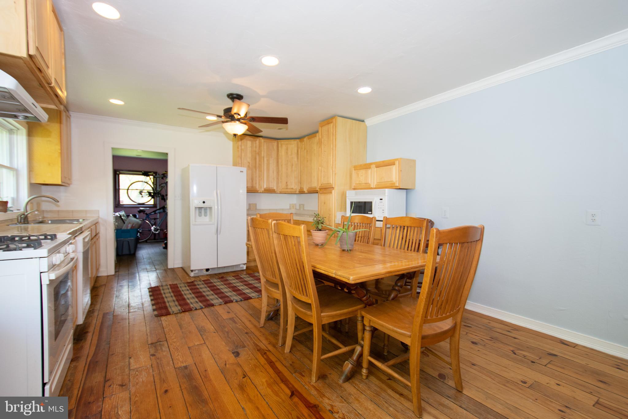 608 Charles Avenue Deale, MD 20751 - Photo 10 of 41 a view of a dining room with furniture and wooden floor