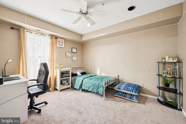 a bedroom with furniture and a window