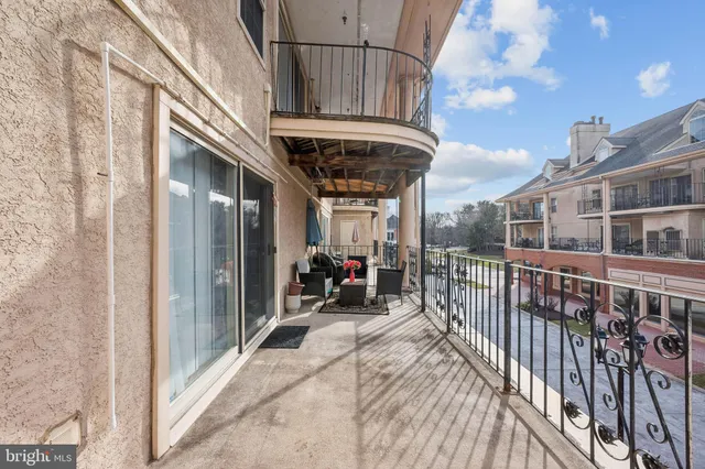 a view of a balcony with sitting area