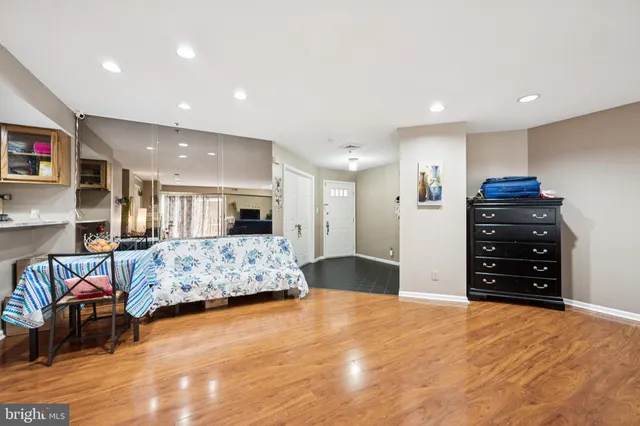 a bedroom with furniture and a flat screen tv