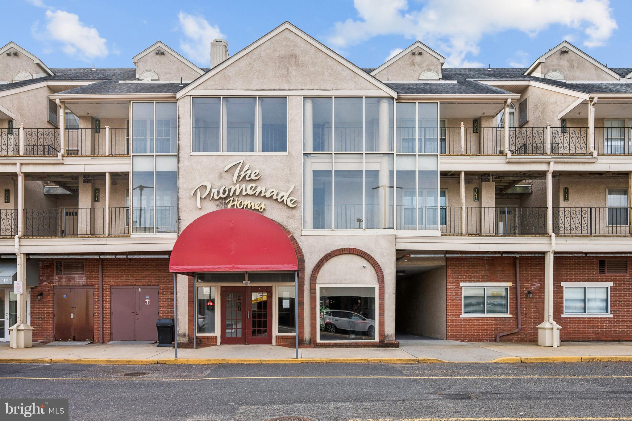 4023 Main Street Voorhees, NJ 08043 - Photo 3 of 28 a front view of a residential apartment building with a yard