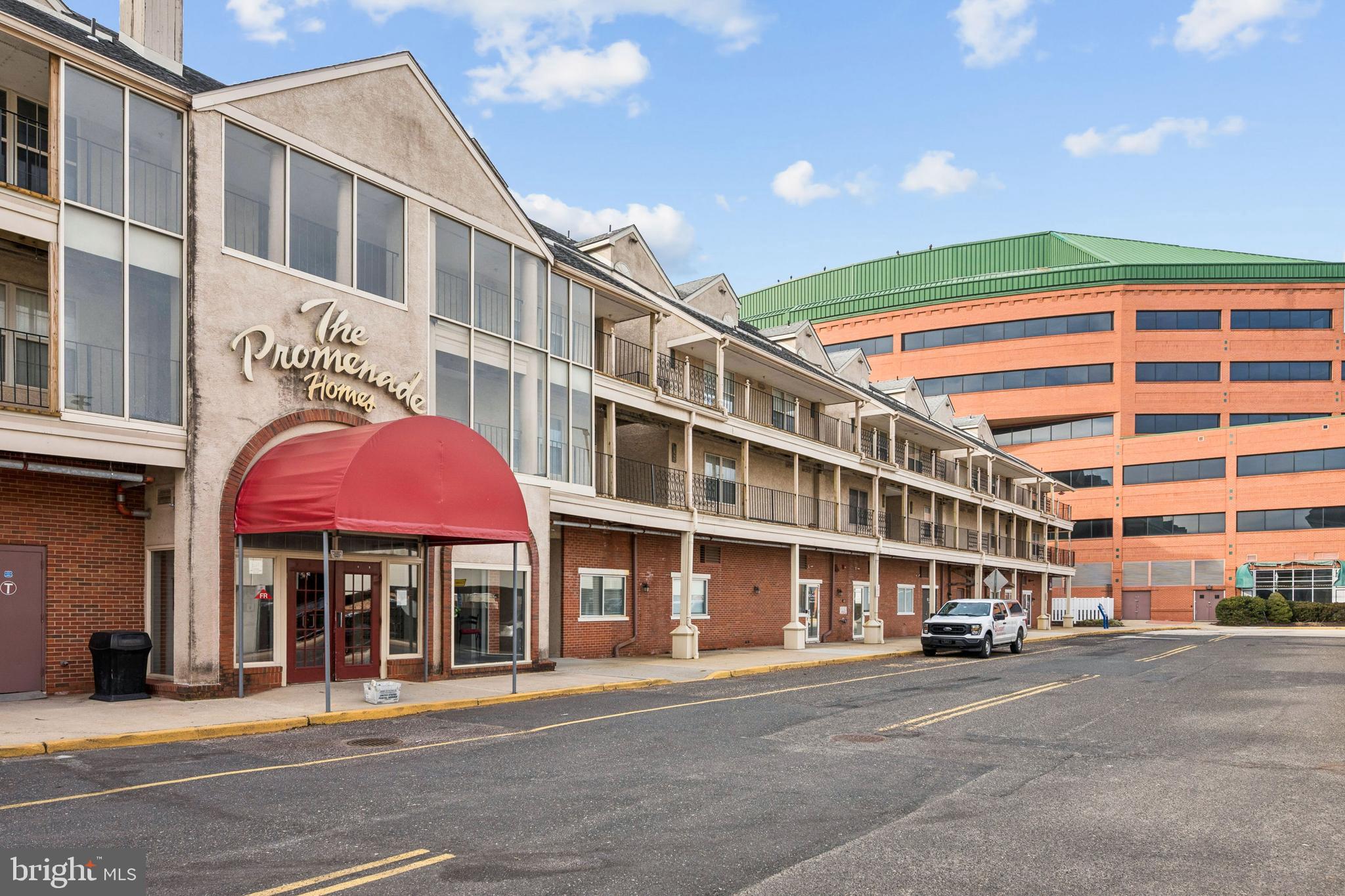 4023 Main Street Voorhees, NJ 08043 - Photo 4 of 28 a front view of a building with a umbrellas