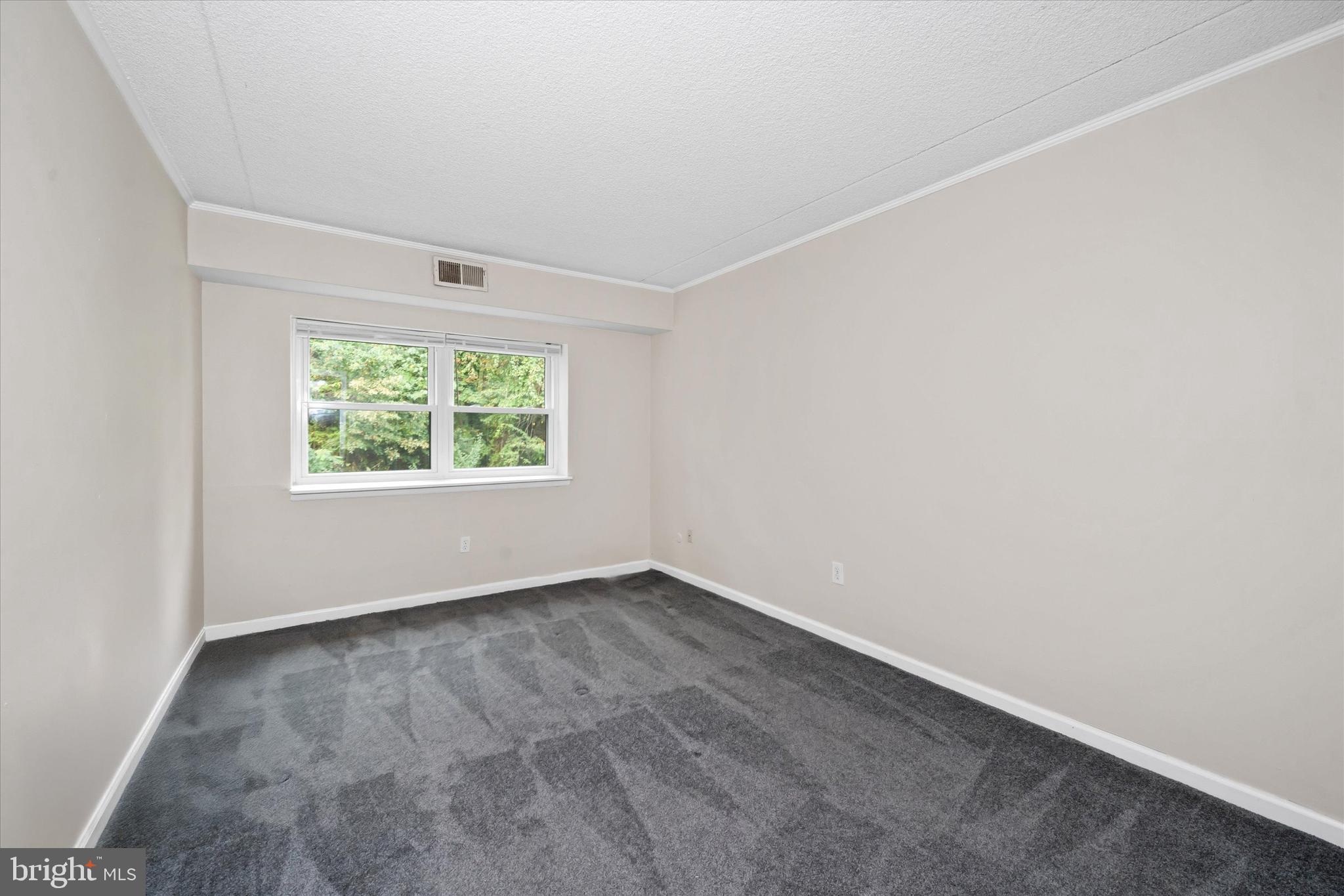 80 Welsh Tract Road, Unit G209 Newark, DE 19713 - Photo 19 of 26 an empty room with a window