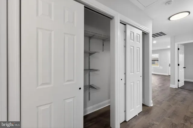 a view of a hallway with two rooms