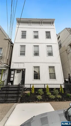 a view of multiple houses with a street