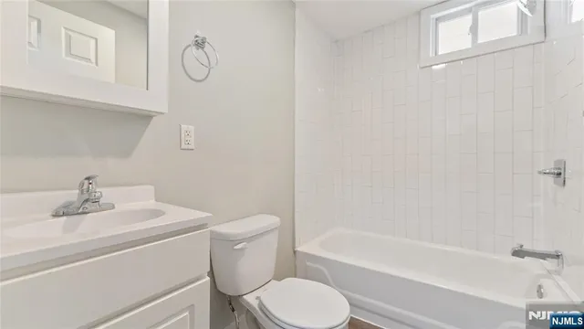a bathroom with a sink toilet and bathtub