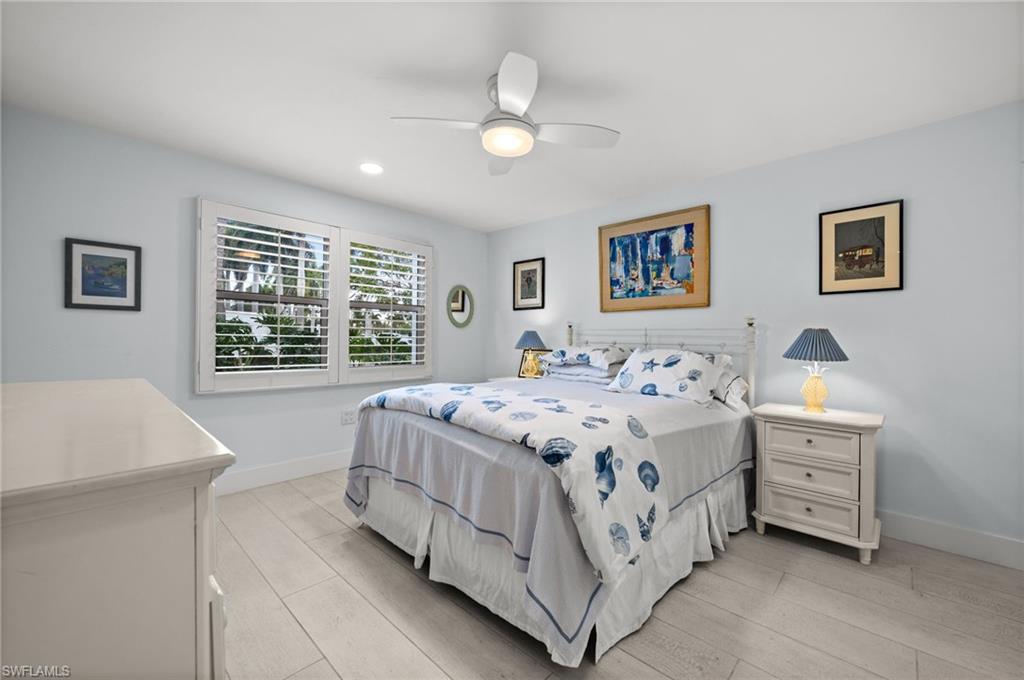 1021 3rd Street South, Unit 112 Naples, FL 34102 - Photo 17 of 27 a spacious bedroom with a bed and a window