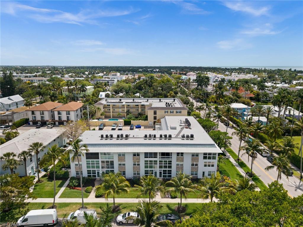 1021 3rd Street South, Unit 112 Naples, FL 34102 - Photo 2 of 27 a view of a city that has tall buildings
