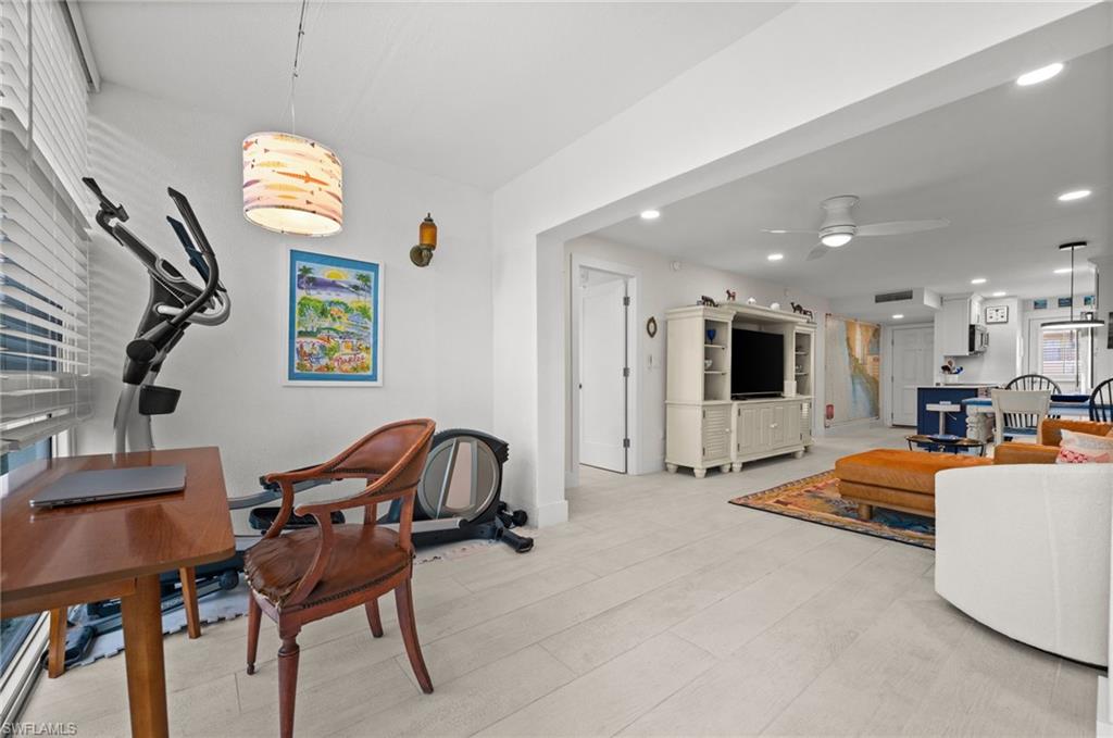 1021 3rd Street South, Unit 112 Naples, FL 34102 - Photo 22 of 27 a workspace with furniture and a window