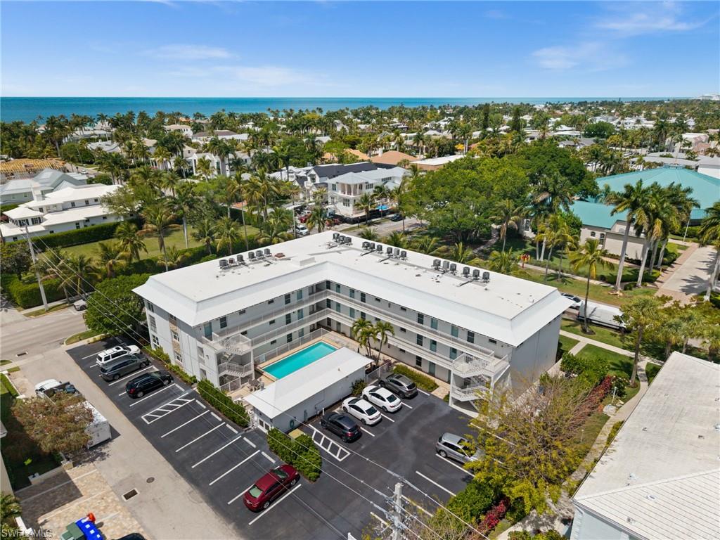 1021 3rd Street South, Unit 112 Naples, FL 34102 - Photo 4 of 27 an aerial view of a house with a garden