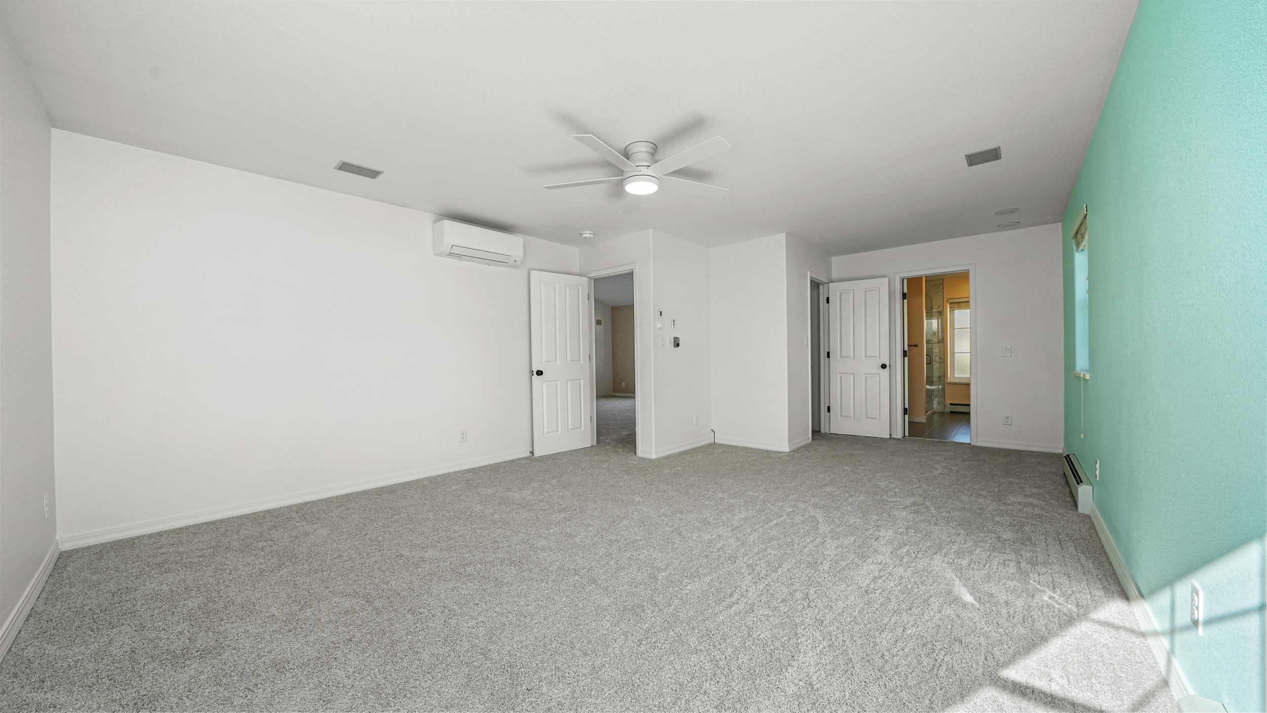 1631 Ptarmigan Ridge Court Grand Junction, CO 81506 - Photo 14 of 33 an empty room with closet and a ceiling fan