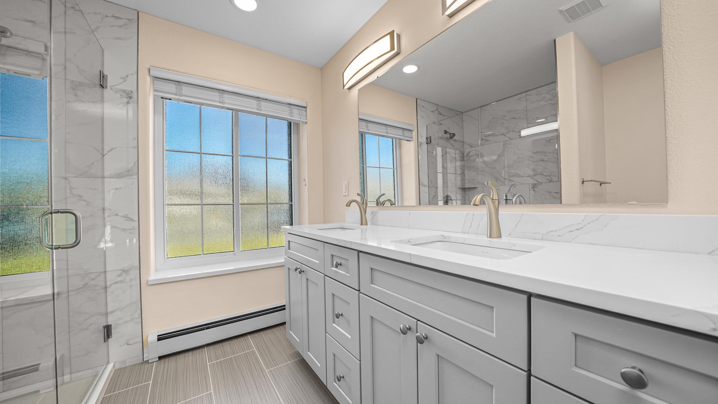 1631 Ptarmigan Ridge Court Grand Junction, CO 81506 - Photo 15 of 33 a bathroom with a granite countertop sink mirror and double