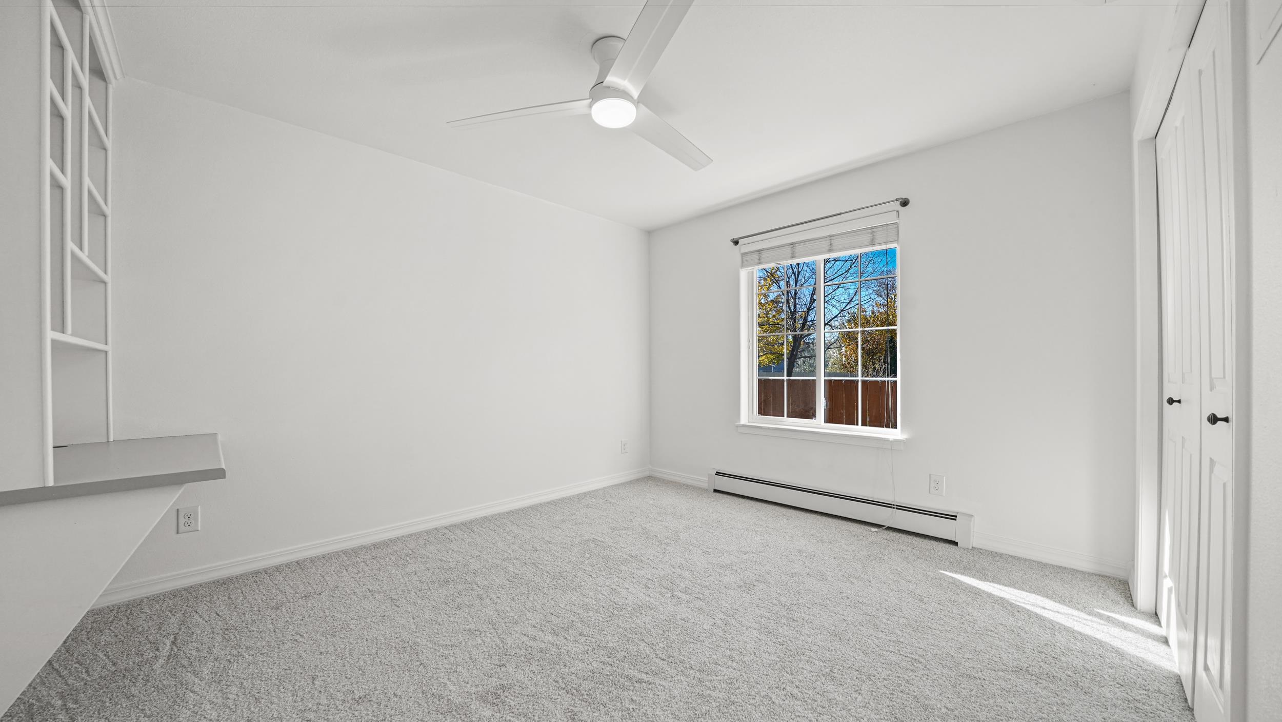 1631 Ptarmigan Ridge Court Grand Junction, CO 81506 - Photo 17 of 33 an empty room with windows and closet