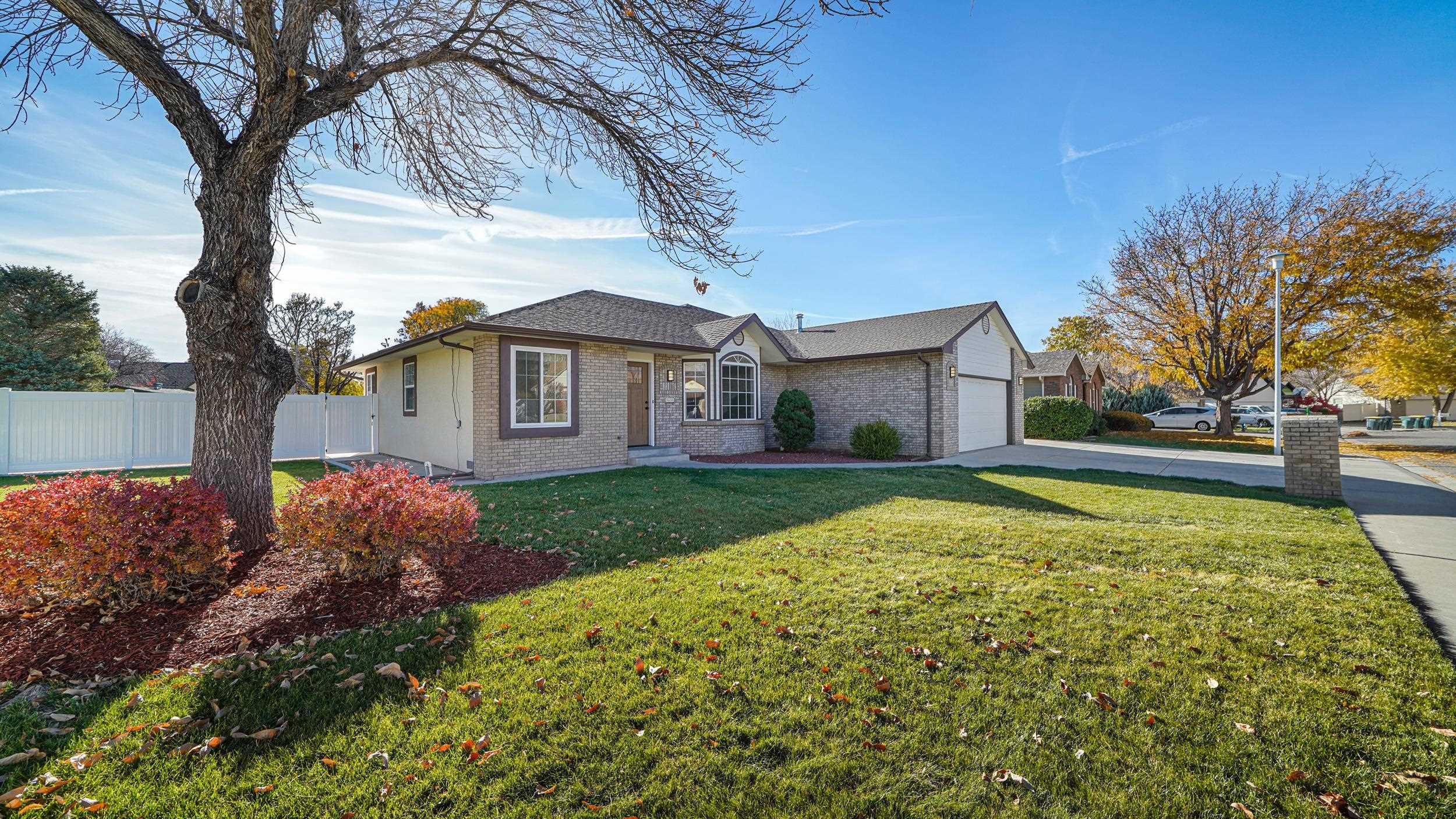 1631 Ptarmigan Ridge Court Grand Junction, CO 81506 - Photo 2 of 33 a view of a house with a yard