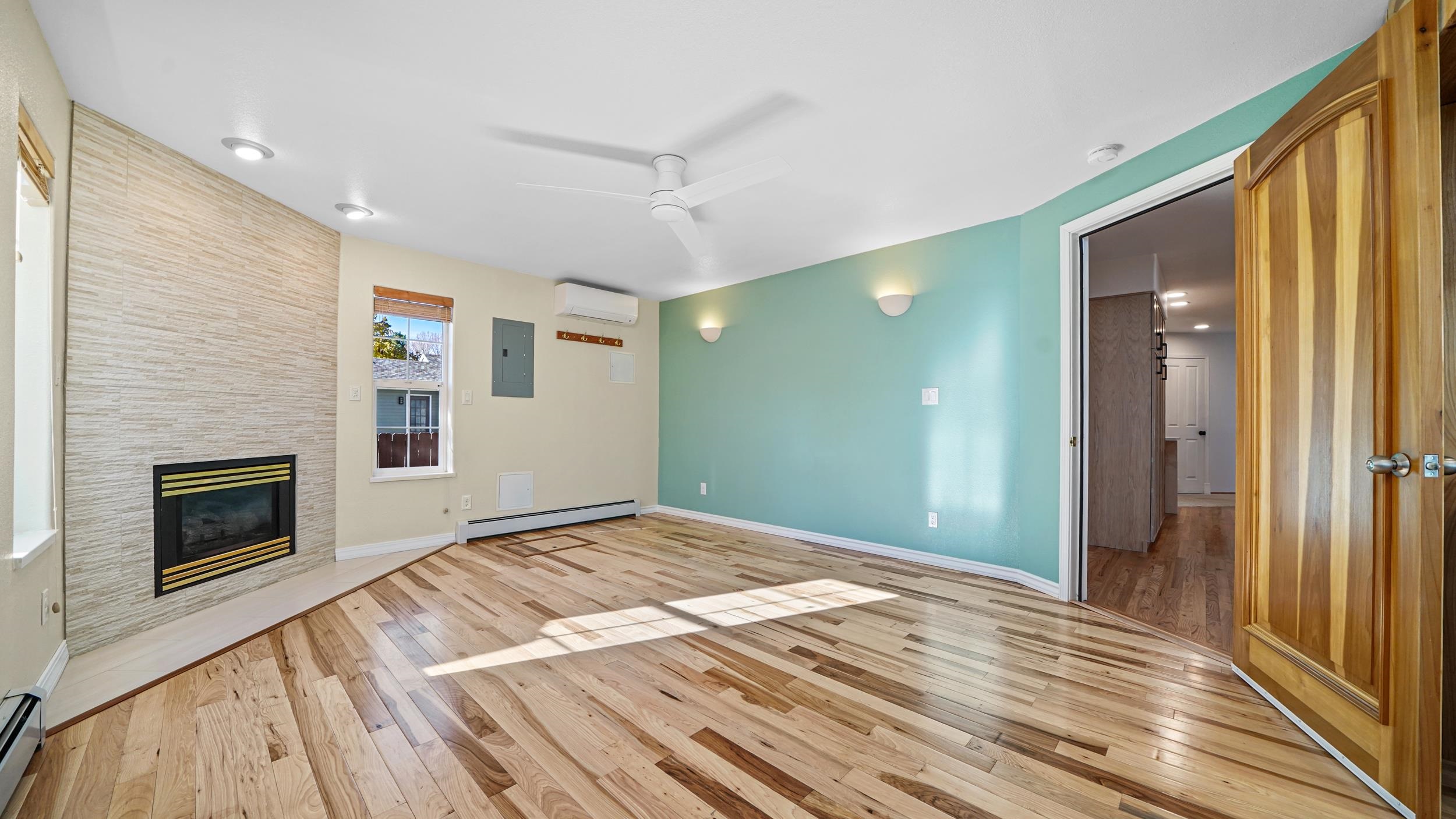 1631 Ptarmigan Ridge Court Grand Junction, CO 81506 - Photo 22 of 33 a view of empty room with wooden floor and fireplace