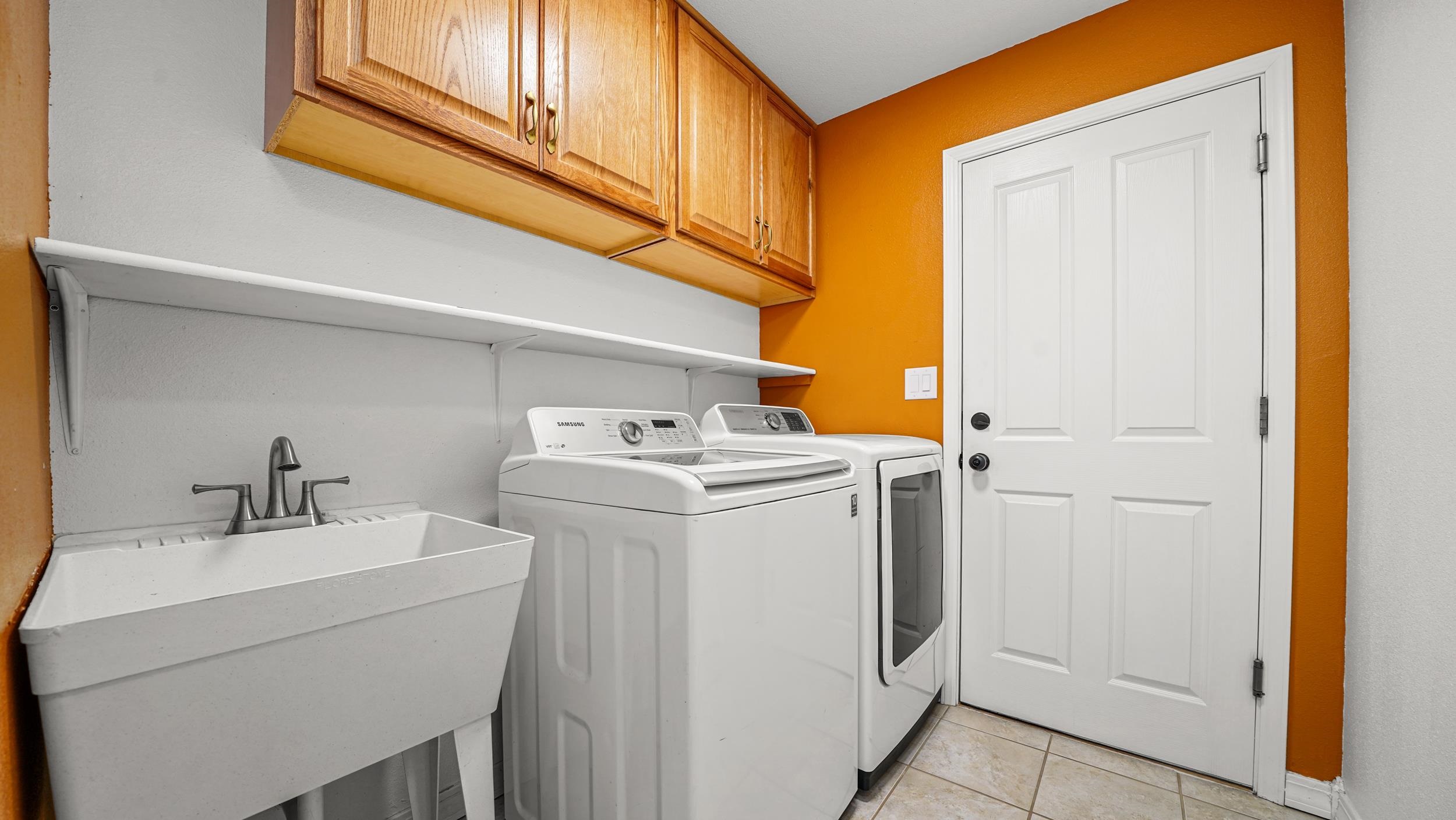 1631 Ptarmigan Ridge Court Grand Junction, CO 81506 - Photo 27 of 33 a utility room with dryer and washer