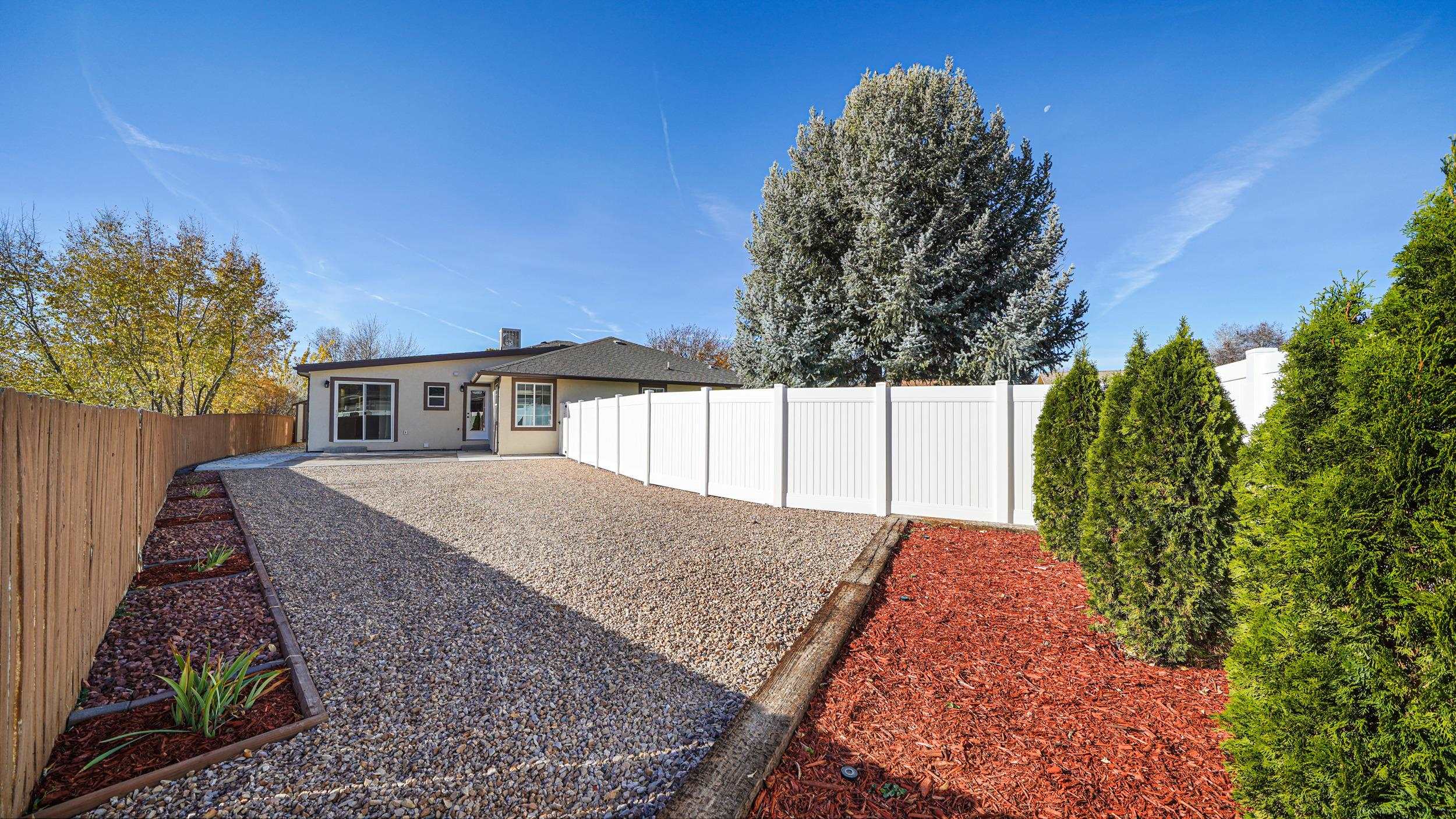 1631 Ptarmigan Ridge Court Grand Junction, CO 81506 - Photo 28 of 33 a view of a house with a yard