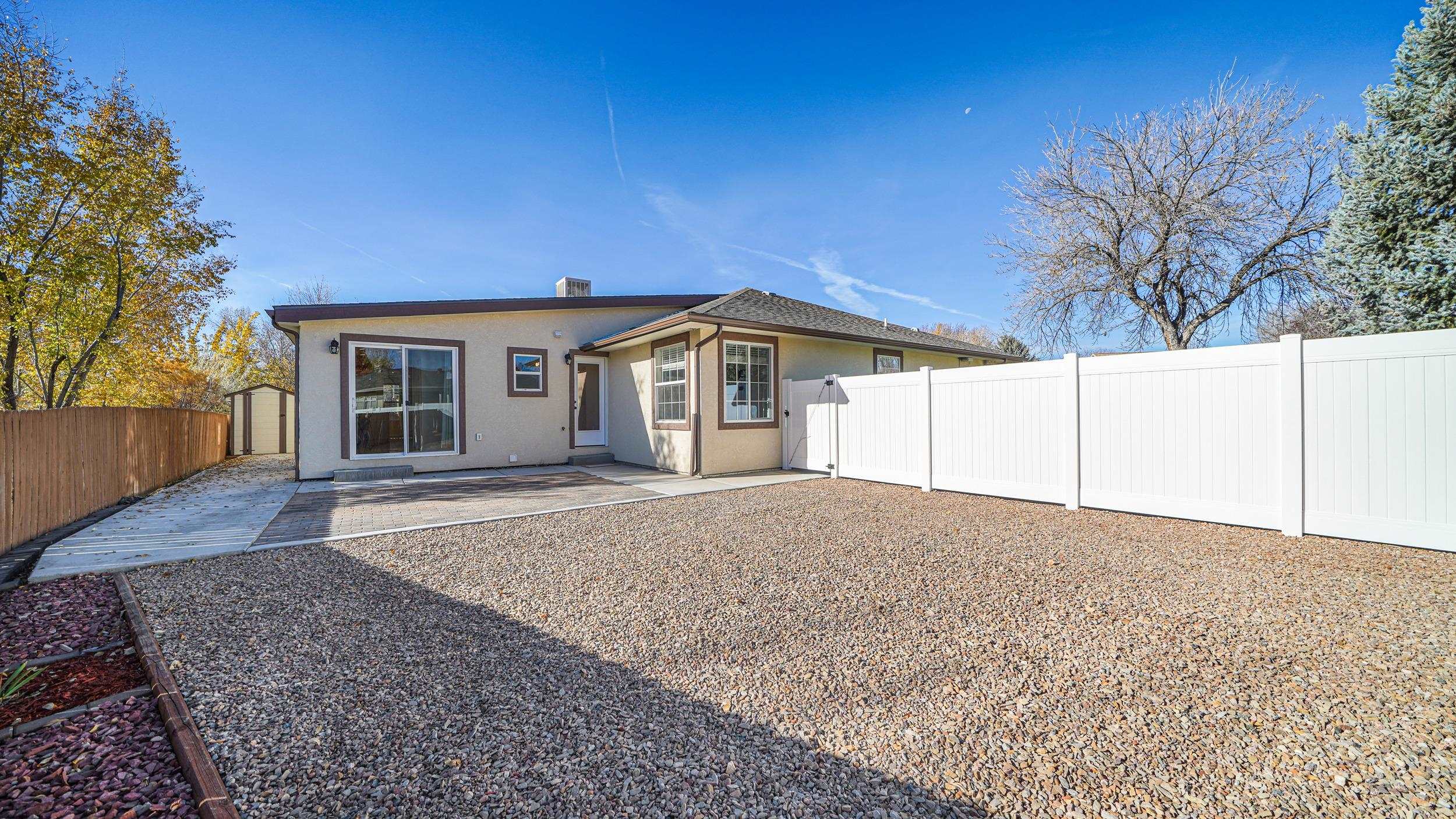 1631 Ptarmigan Ridge Court Grand Junction, CO 81506 - Photo 29 of 33 front view of a house with a dry yard